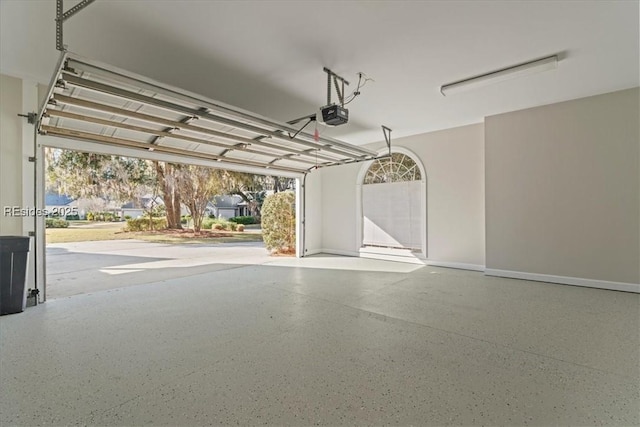 garage featuring a garage door opener