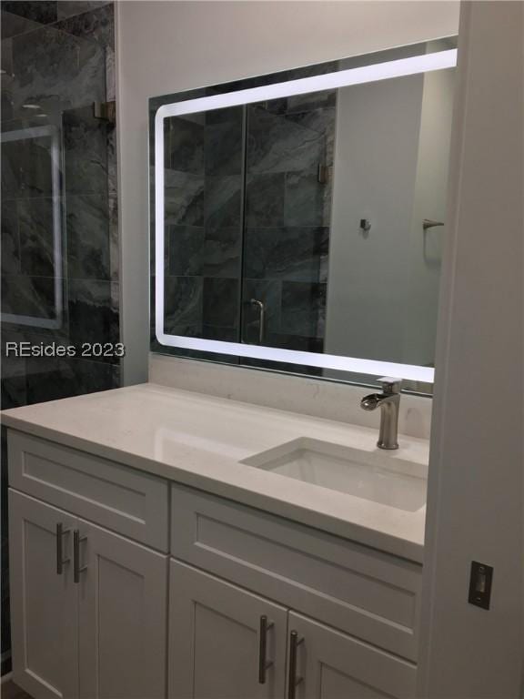 bathroom with vanity and an enclosed shower