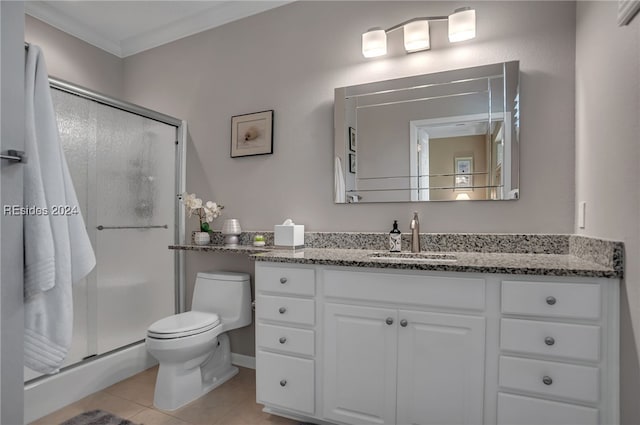 bathroom featuring ornamental molding, a shower with shower door, tile patterned floors, and vanity