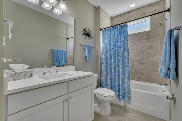 full bathroom with vanity, toilet, and shower / bath combo with shower curtain