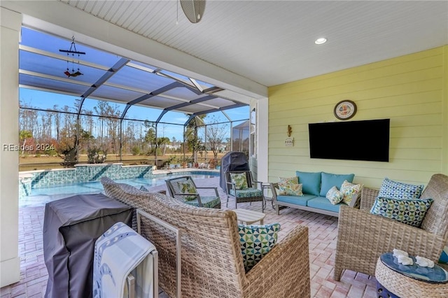 view of patio / terrace with ceiling fan, outdoor lounge area, and glass enclosure