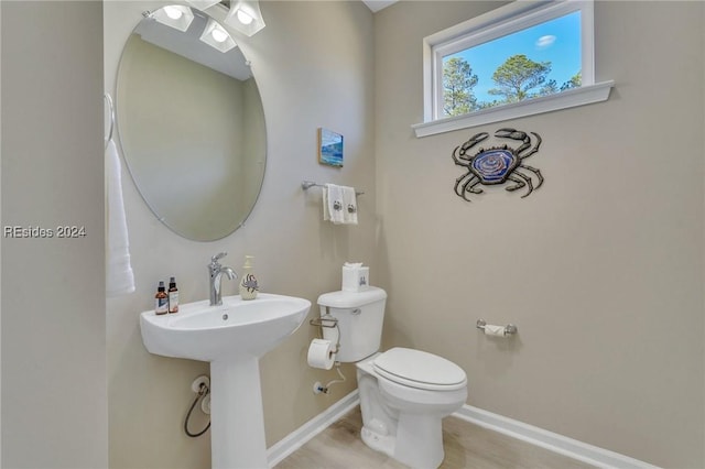 bathroom with sink and toilet