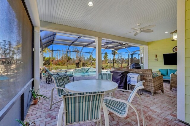 sunroom / solarium with ceiling fan