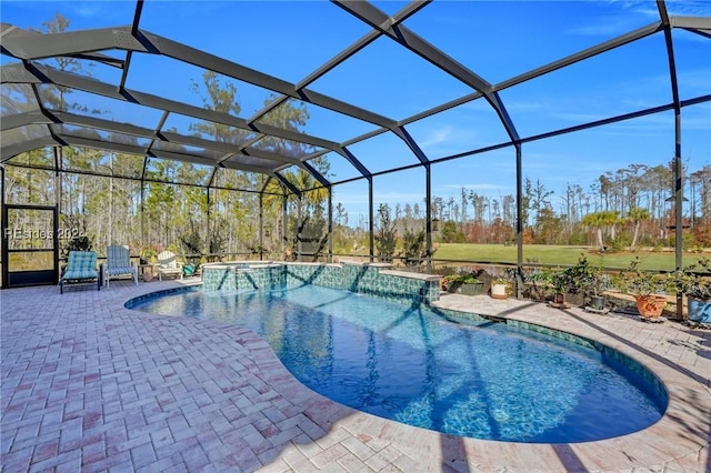 view of pool featuring a lanai and a patio area