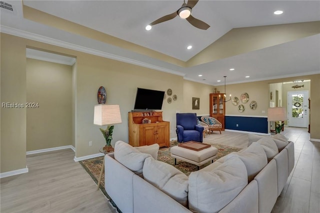 living room featuring ceiling fan, ornamental molding, and light hardwood / wood-style flooring