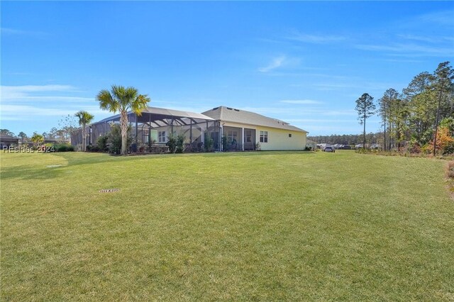 view of yard with a lanai