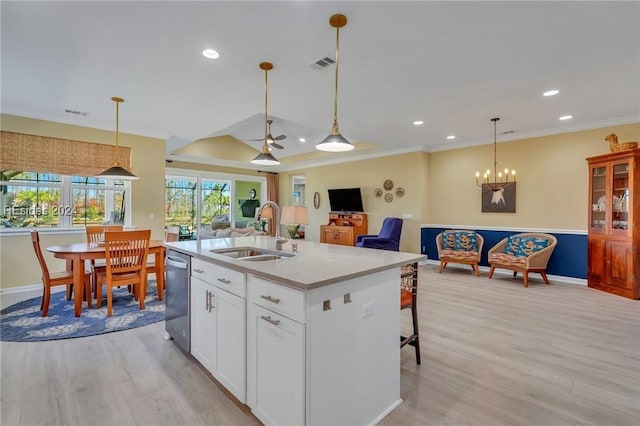 kitchen with sink, white cabinets, a center island with sink, decorative light fixtures, and stainless steel dishwasher