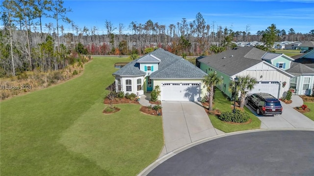 view of front facade featuring a garage and a front lawn