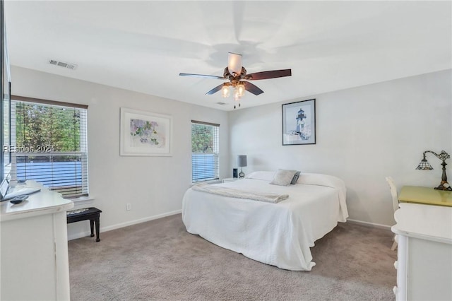 bedroom featuring light carpet and ceiling fan