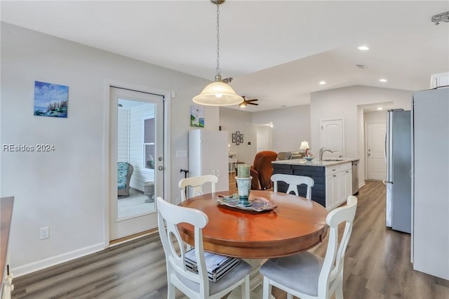 dining room with wood-type flooring and sink