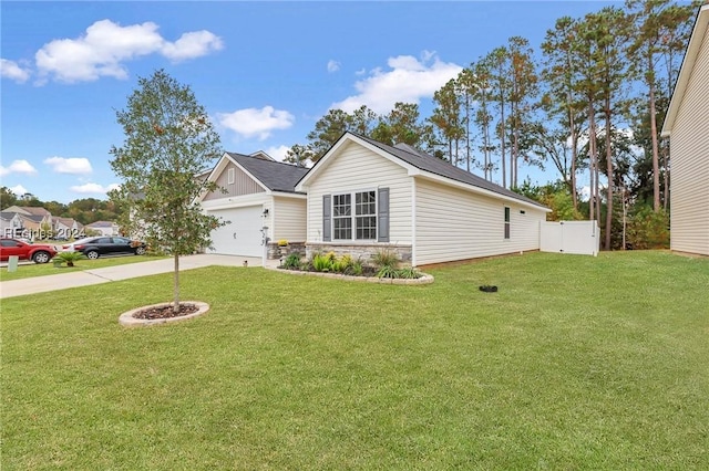 view of front of home with a garage and a front lawn