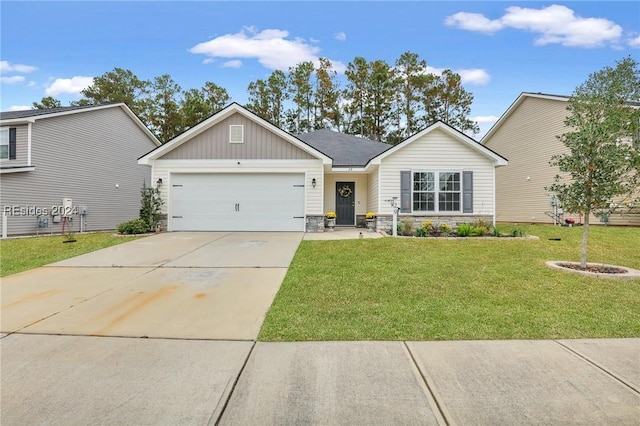 view of front of house with a garage and a front yard