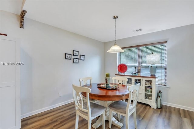 dining area with dark hardwood / wood-style floors and a wealth of natural light