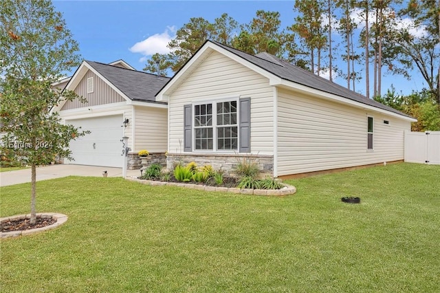 view of front of property with a garage and a front lawn