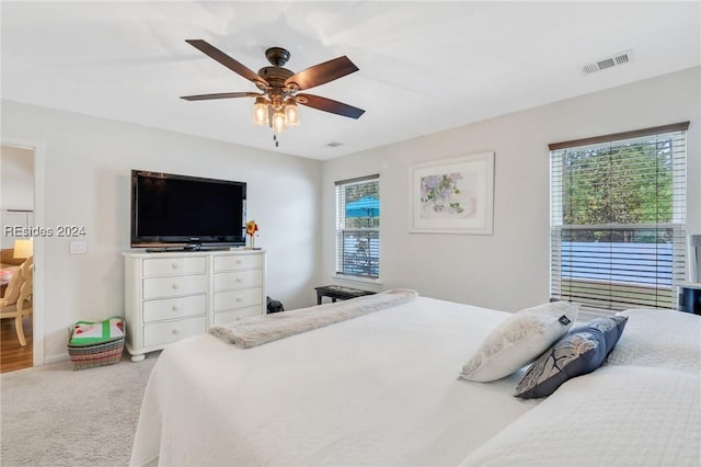 bedroom featuring ceiling fan and carpet flooring