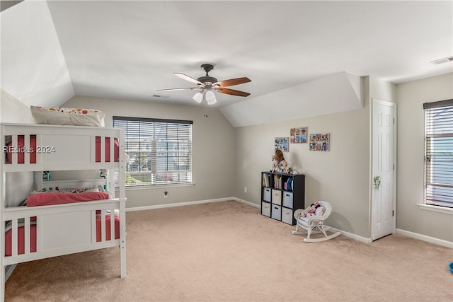 carpeted bedroom featuring vaulted ceiling and ceiling fan