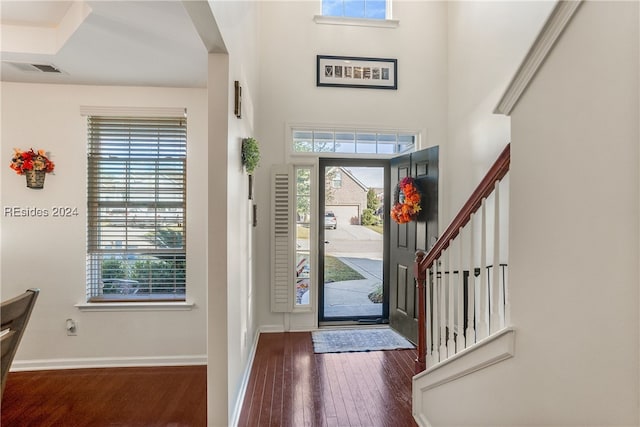 foyer entrance with dark hardwood / wood-style floors