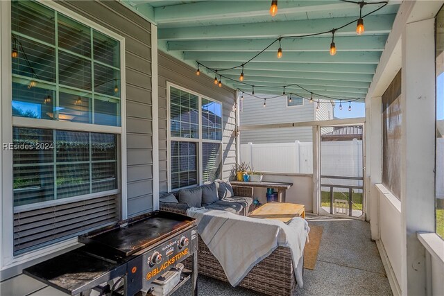 sunroom / solarium with lofted ceiling and plenty of natural light