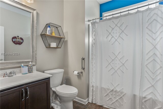 full bathroom featuring shower / bath combination with curtain, vanity, toilet, and tile patterned flooring