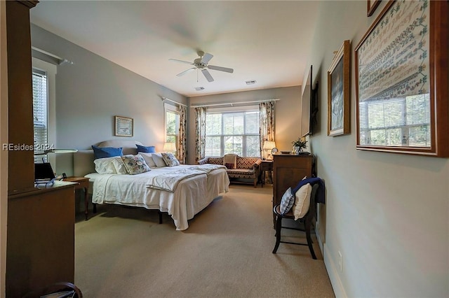 bedroom with ceiling fan and carpet