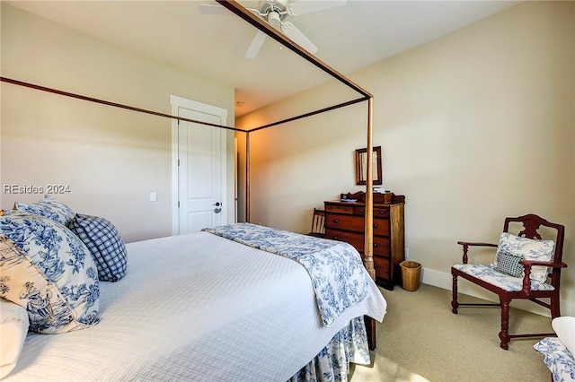 bedroom with ceiling fan and carpet