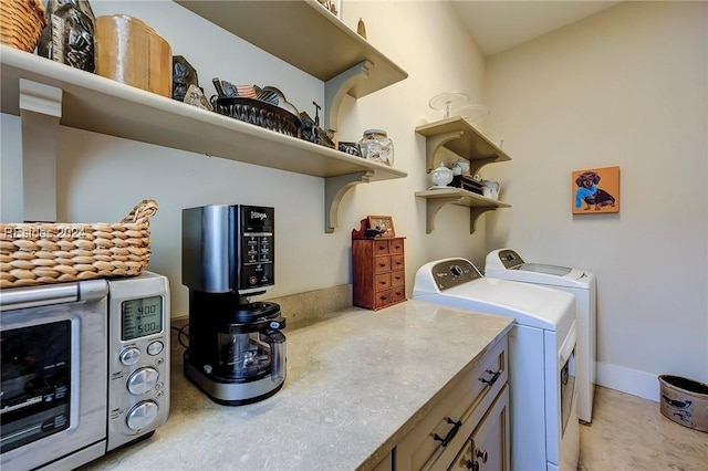 clothes washing area featuring washing machine and clothes dryer