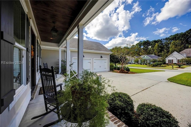 exterior space with a garage and covered porch