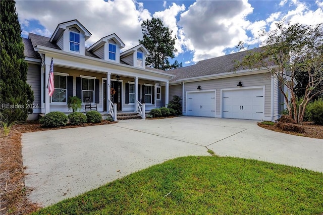 view of front facade with a garage and covered porch