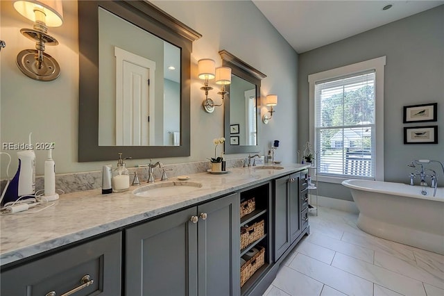 bathroom with vanity and a tub