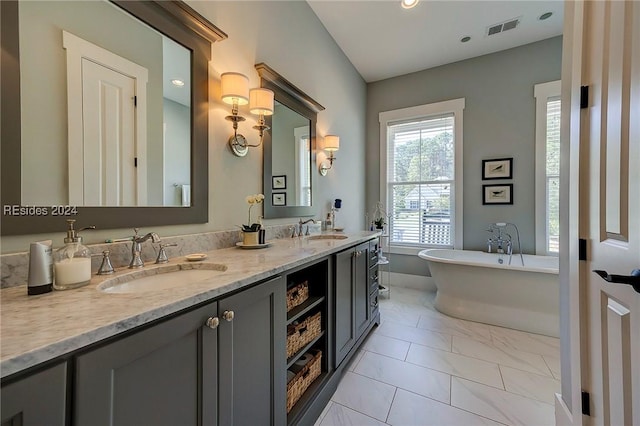 bathroom featuring vanity and a bathtub