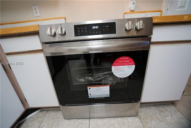 details with double wall oven and white cabinets