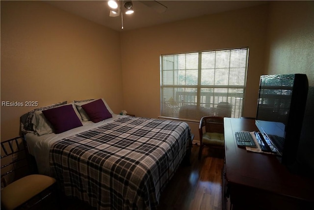 bedroom featuring dark wood-type flooring and ceiling fan