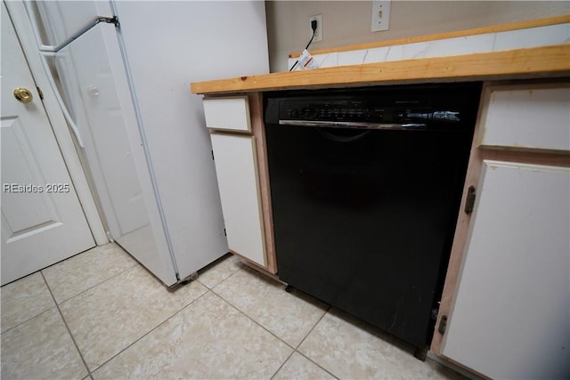 room details featuring white refrigerator, dishwasher, and white cabinets