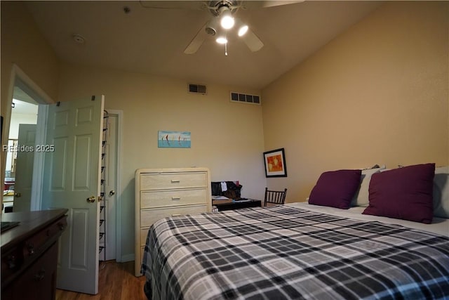 bedroom with lofted ceiling, wood-type flooring, and ceiling fan