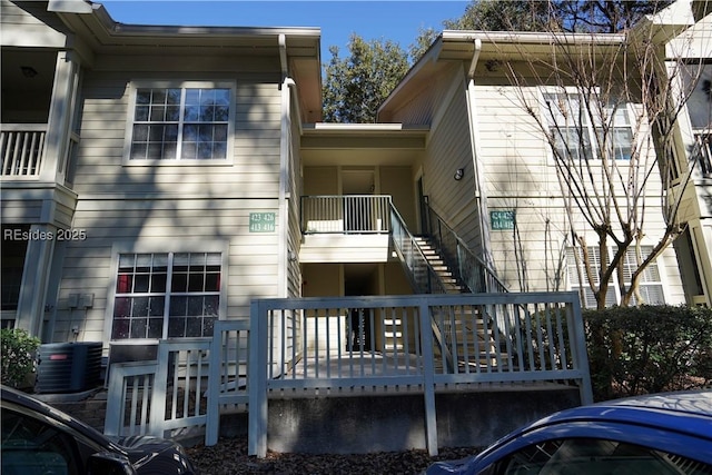 rear view of house with cooling unit