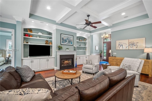 living room featuring built in shelves, dark wood-type flooring, coffered ceiling, crown molding, and beam ceiling