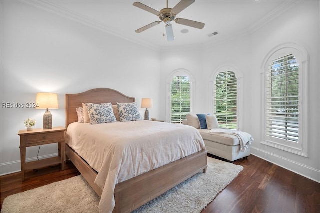 bedroom featuring crown molding, dark hardwood / wood-style floors, and ceiling fan