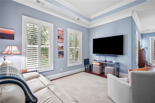 living room featuring wood-type flooring and ornamental molding