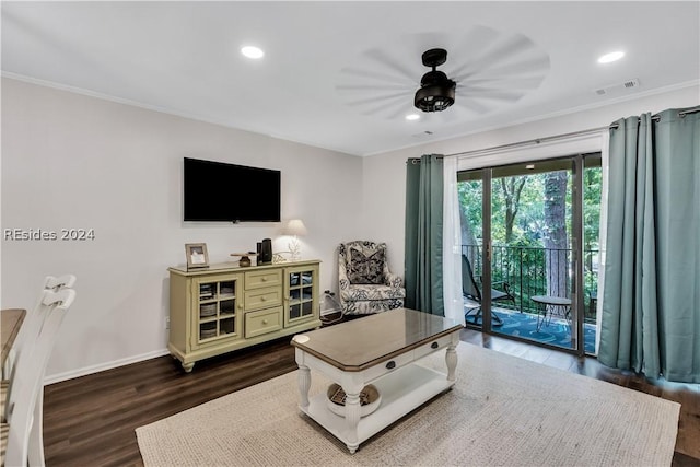 living room featuring crown molding and dark hardwood / wood-style floors