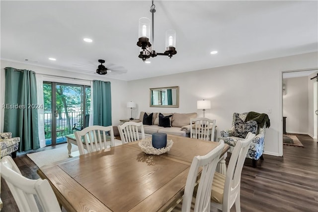 dining area with dark hardwood / wood-style flooring and ceiling fan with notable chandelier