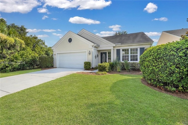 single story home with a garage and a front lawn