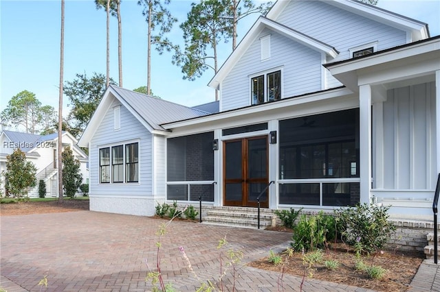 view of front of home with a sunroom