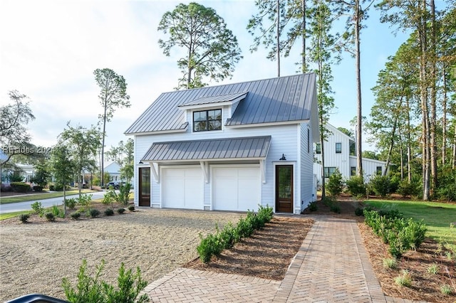 modern farmhouse featuring a garage