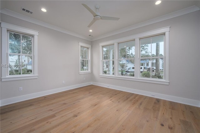 empty room featuring ornamental molding, ceiling fan, and light hardwood / wood-style flooring