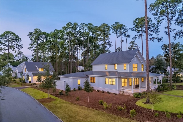 exterior space with a porch and a yard