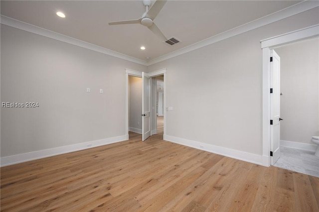 unfurnished room featuring ceiling fan, ornamental molding, and light hardwood / wood-style flooring