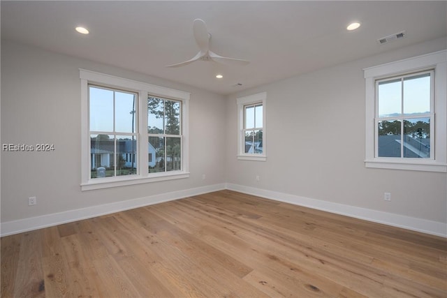 unfurnished room with light hardwood / wood-style floors and ceiling fan