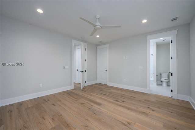 unfurnished room featuring ceiling fan and light wood-type flooring