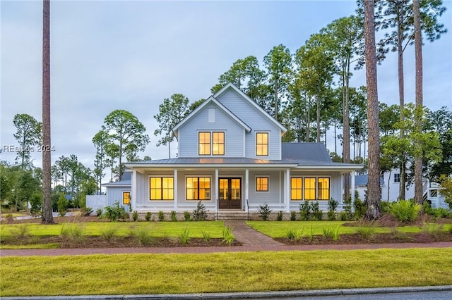 view of front facade featuring a front lawn and a porch