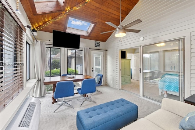 sunroom with vaulted ceiling with skylight and wooden ceiling